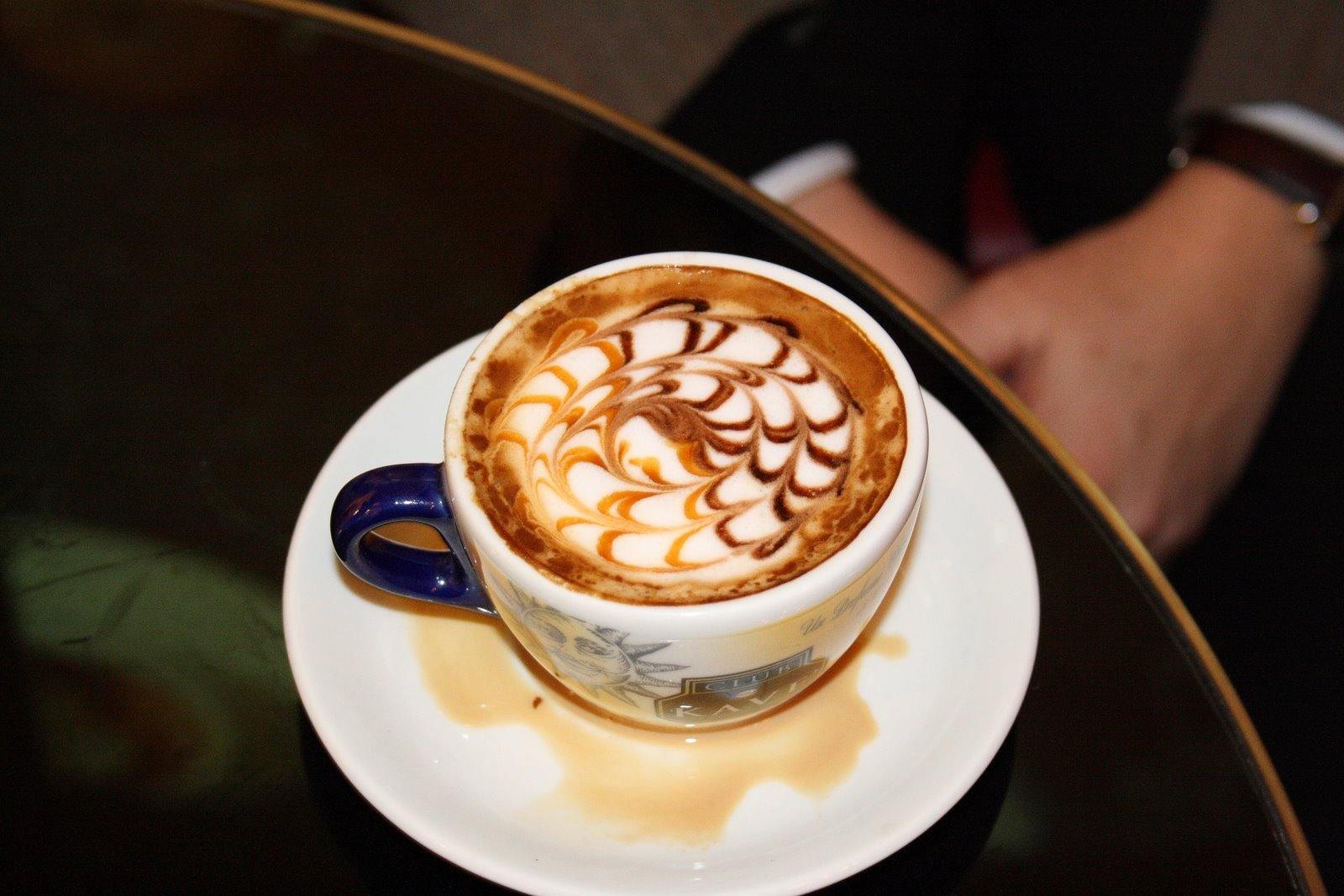 Latte art in a blue cup